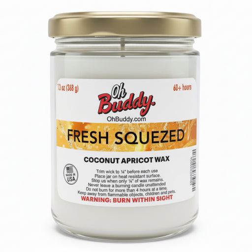 Candle jar labeled 'Oh Buddy Fresh Squeezed Coconut Apricot Wax' on a white background
