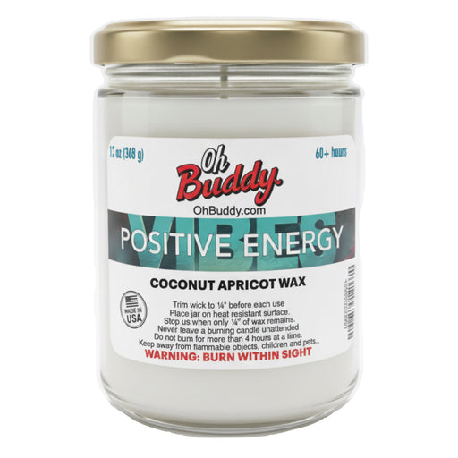 Candle jar labeled 'Oh Buddy Positive Energy' with a gold lid on a white background