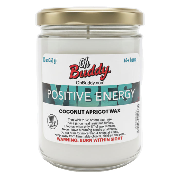 Candle jar labeled 'Oh Buddy Positive Energy' with a gold lid on a white background